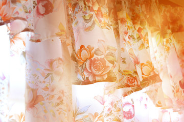 warm blurry background of floral pattern curtains.