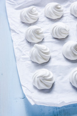 White homemade meringue on baking paper