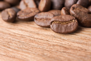 Close up a coffee beans on the wooden table