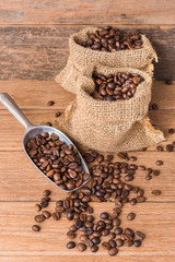 Various types of coffee beans in the wood bolw on the wooden table