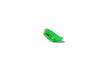 miniature garden pea model from japanese clay on white background