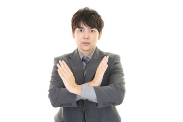 禁止の意思表示をするビジネスマン