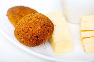 cup of coffee with chease and oat cookies