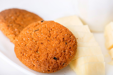 cup of coffee with chease and oat cookies