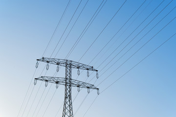 High voltage tower with blue sky background