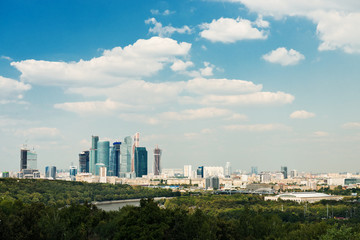 Fototapeta premium above view Moscow cityscape and blue clouds