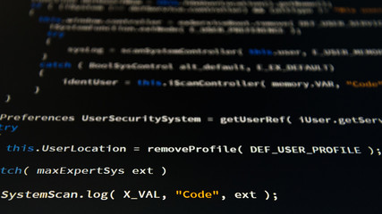 Software developer programming code. Abstract computer script code. Shallow depth of field,...