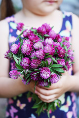 Fototapeta premium bouquet in the hands of a girl
