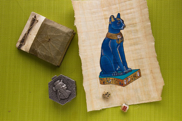 Objects from a trip to Egypt. Egyptian papyrus with a cat and me