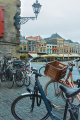 Old town square or Dutch Markt with bicycle parking lot in Delft Netherlands