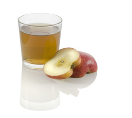 glass of apple juice with a slice of apple