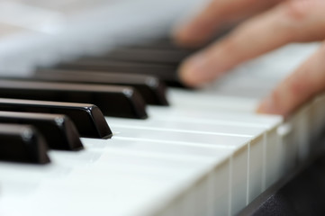 Fototapeta na wymiar Piano with players hands