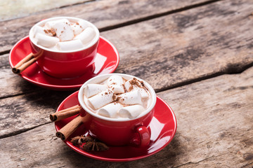 Hot chocolate with marshmallow on wooden table