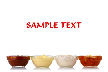 Assorted sauces in a bowl isolated on a white background with your text