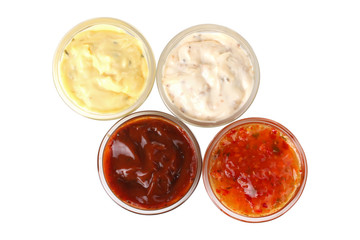 Assorted sauces in a bowl isolated on white background