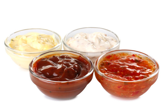 Assorted sauces in a bowl isolated on white background