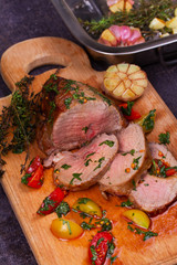 Steak with Tomatoes, Thyme, Coriander and Garlic on Cutting Board