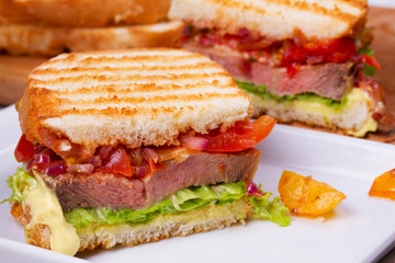 Beef Sandwich with Tomatoes, Coriander, Red Onion and Green Salad