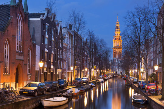Church and a canal in Amsterdam at night