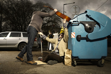 Poor man with trash can loosing his quitar