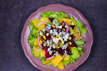 Orange, Beetroot, Blue Cheese, Red Onion and Pistachios Salad. View from above, top studio shot