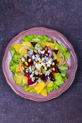 Orange, Beetroot, Blue Cheese, Red Onion and Pistachios Salad. View from above, top studio shot