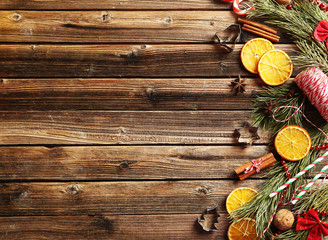 Christmas tree branch with dried oranges, cinnamon and anise sta