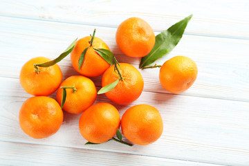 Ripe mandarin on a blue wooden table