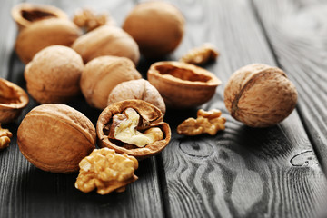 Walnuts on a black wooden table