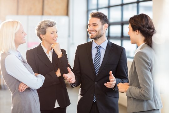 Business Team Standing And Speaking