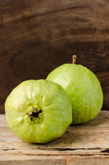 Fresh guava (tropical fruit) on wooden background