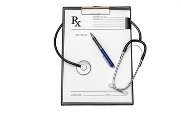 Prescription form with pen and stethoscope on clipboard isolated