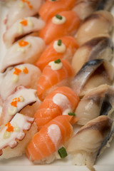 Various sushi on the  platter salmon tuna