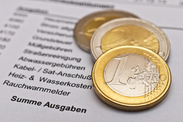 Betriebskostenabrechnung und Münzen