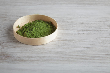 Side view matcha tea in box on table