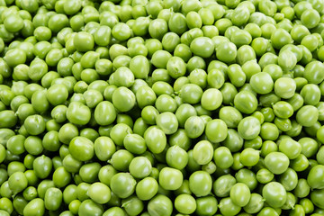 Fototapeta na wymiar Fresh peas. Green background.
