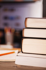 Obraz premium Books stacked on the desk