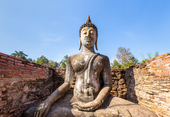 Fototapeta na wymiar Buddha in small chapel at Wat Si Chum , Shukhothai Historical Pa