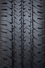 Tyre tread textured car wheel close-up