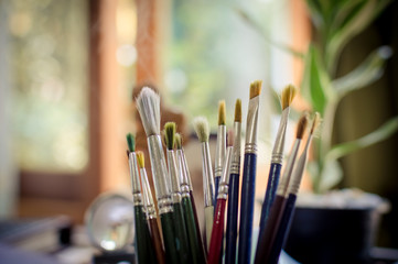 Art brushes in a colorful background