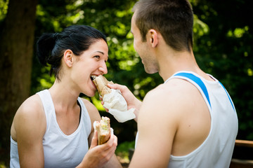 Eating together -  couple after sport training