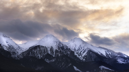 Fototapeta na wymiar Mountain peaks with dramatic clouds and sky