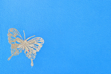 golden butterfly on blue background