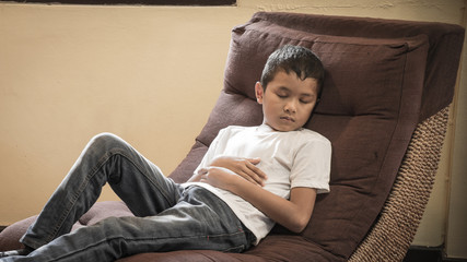 scared and alone, young Asian child who is at high risk of being bullied, trafficked and abused