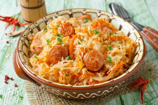 Cabbage stew with grilled sausage