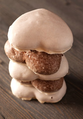 Stacked gingerbread heart-shaped on the wooden table