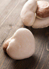 Gingerbread heart-shaped on the wooden table