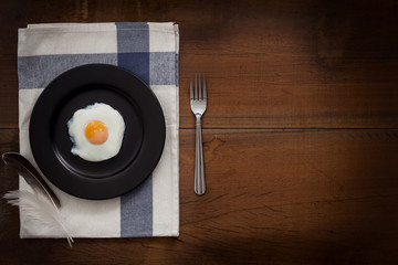 eating fried eggs flat lay still life rustic with food stylish