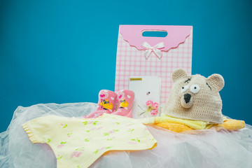 The baby clothes with a  gift box