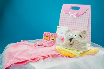 The baby clothes with a  gift box